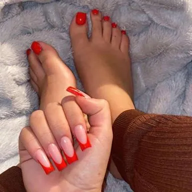 Red French tips on hands with matching red toes