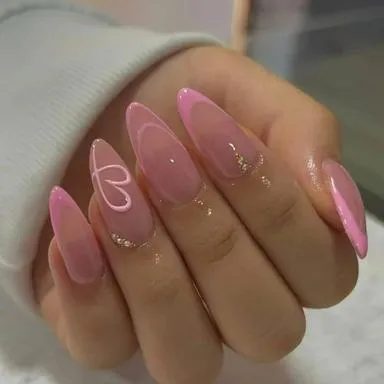 Pink almond nails with a heart outline